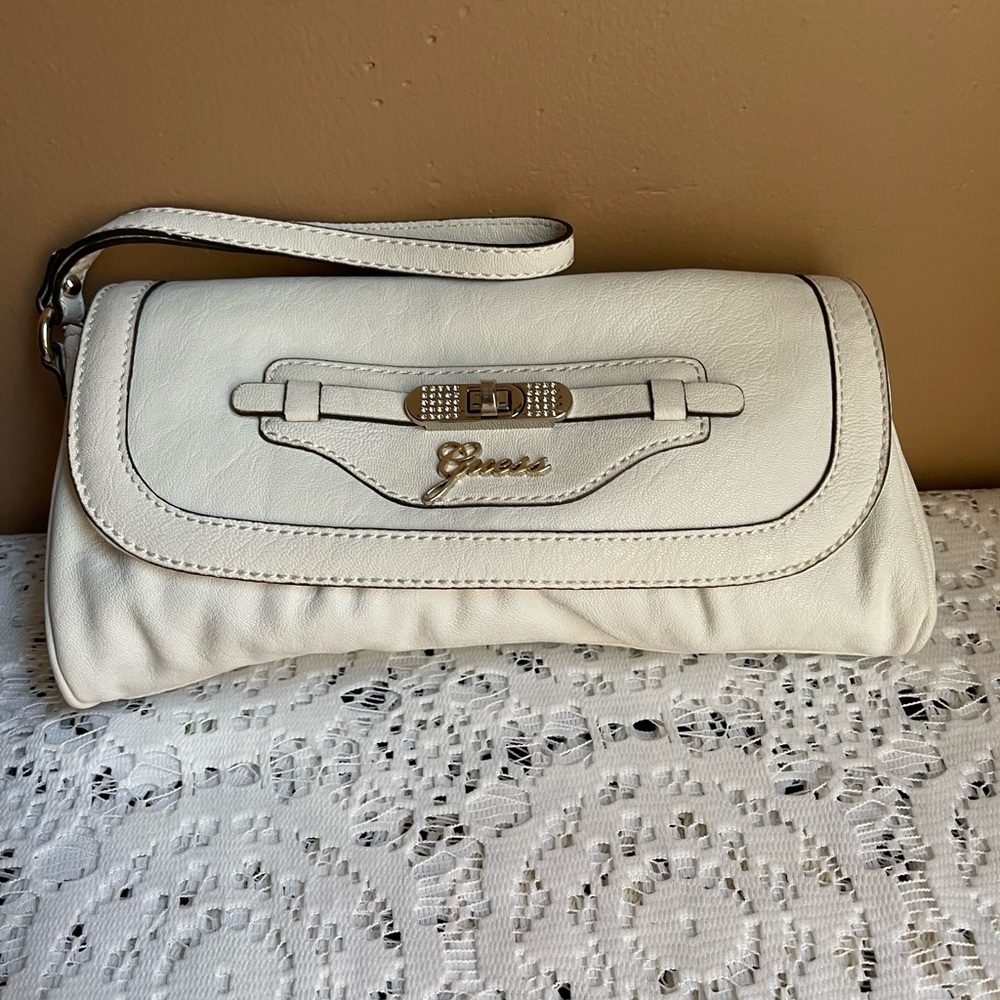 NWOT Guess White Clutch 10 inches wide by 5 inches in height.